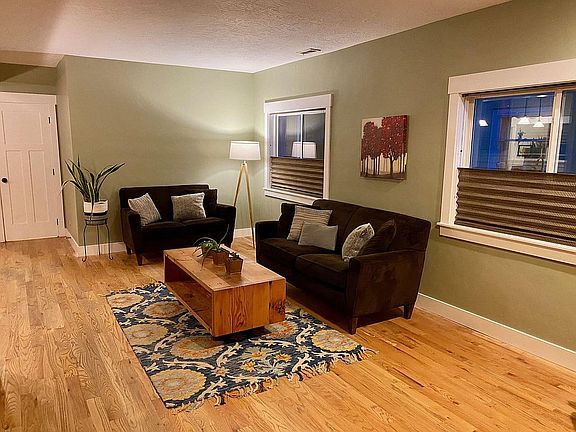 Living room is part of open floor plan with kitchen and dining room.
