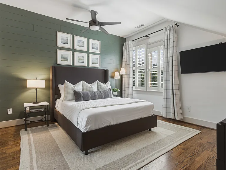 Find a comfortable queen bed in bedroom 3, along with a walk-in closet, dresser, smart TV, and ceiling fan.