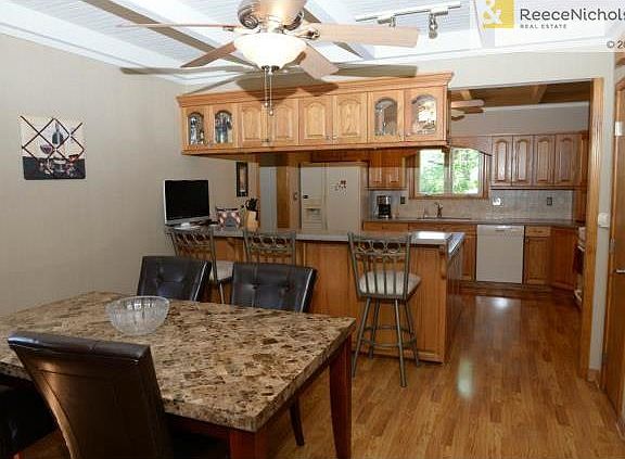Dining room and kitchen with bar area for casual dining.