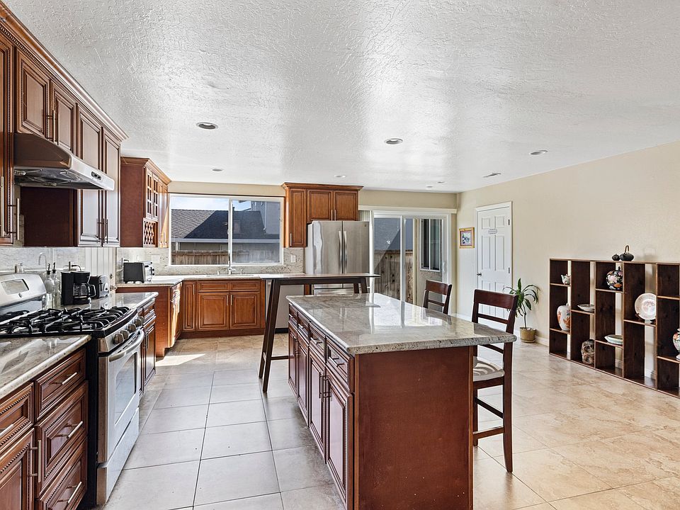Kitchen is fully stocked with basic spices, pots, pans and dishes.