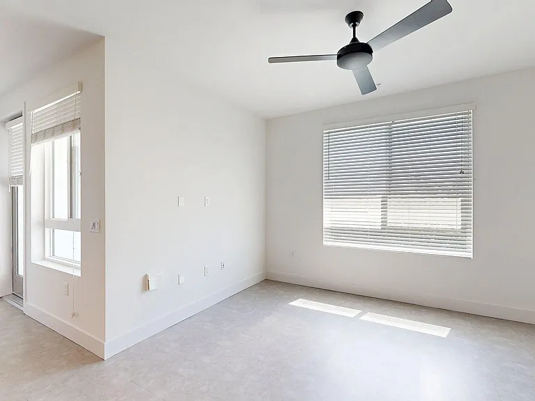 Apartment living room with wood style floor.