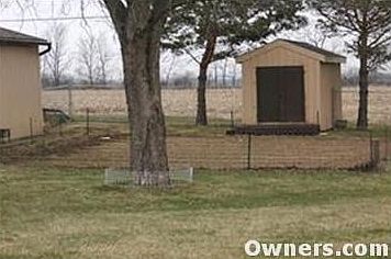 back yard w/fenced garden plot