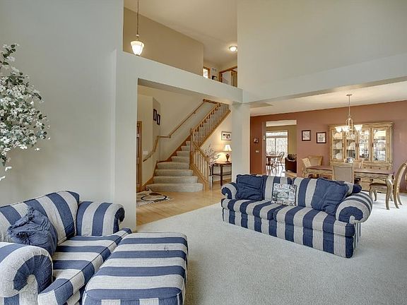 Open floor plan defines distinct rooms through architecture and open spaces and not closed walls