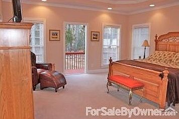 Wonderful Master Bedroom : Master Bedroom has double trey ceiling, ceiling fan and opens to back dec