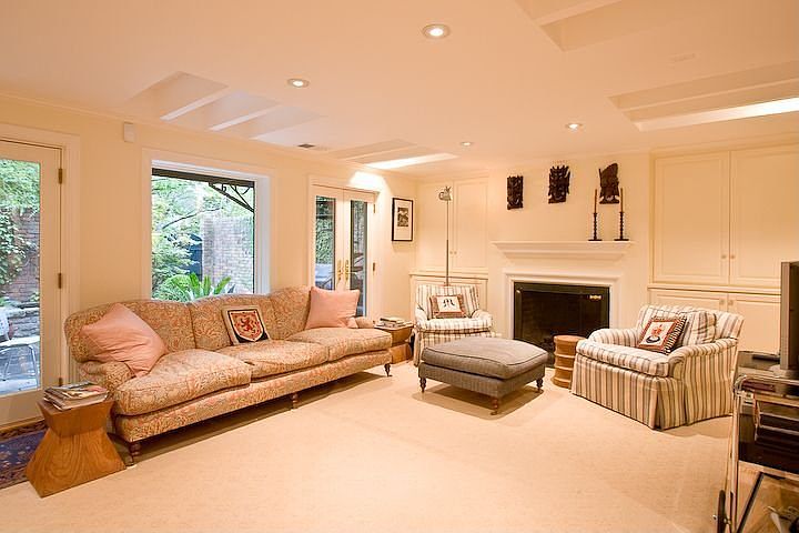FAMILY ROOM ANCHORED BY A WOOD BURNING FIREPLACE