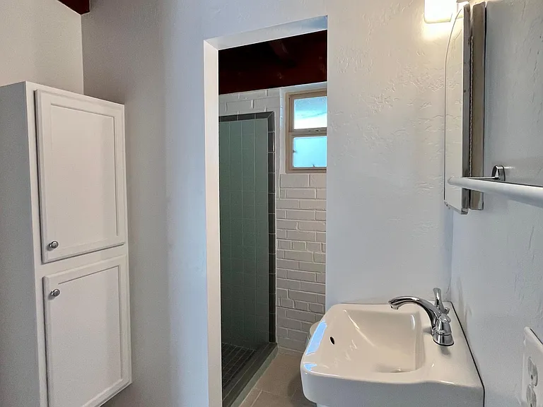 Bathroom - standard stall shower (2.5x2.5), linen cabinet, etc.