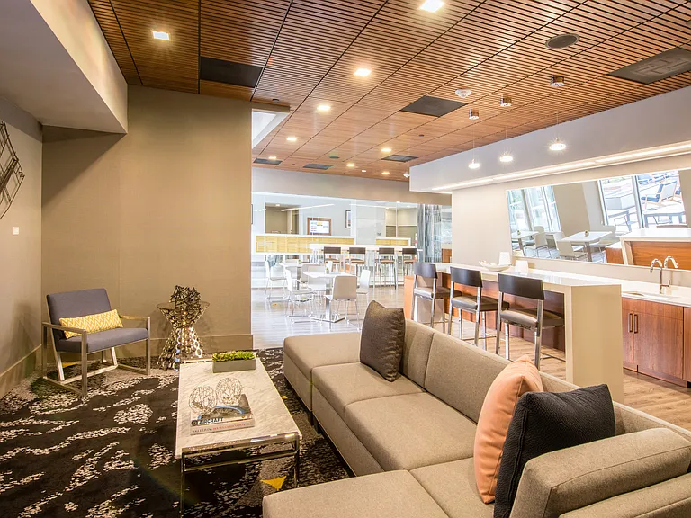 Stylish Clubroom with Kitchen, Social Seating Areas, and Work from Home Spaces