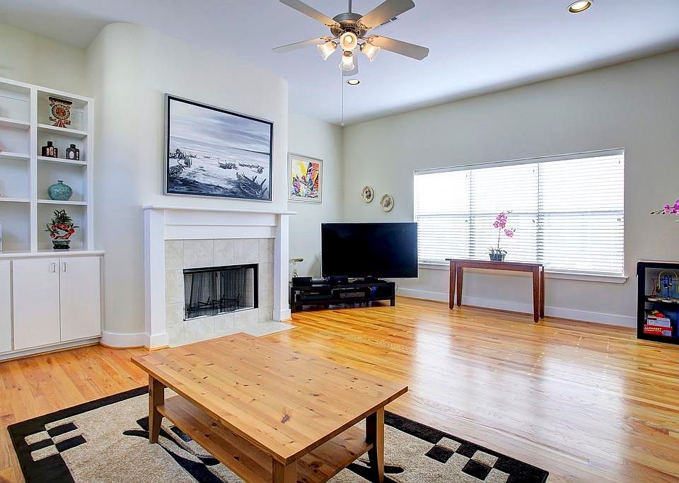 Huge windows provide great natural light. Notice the gas fireplace