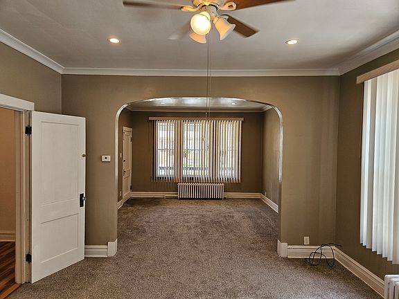 Dining room and adjoining Living room facing front entrance (Bedroom #1 is on the left side).