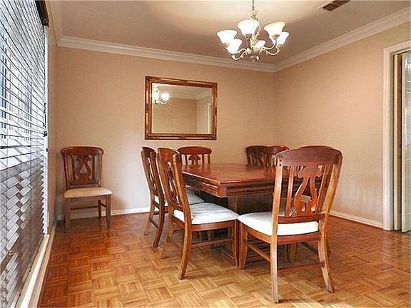 Wood floors in dining and living areas.