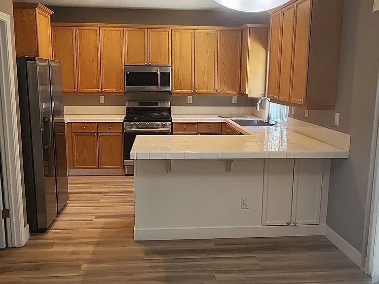 open Kitchen with all new stainless steel appliances, including gas stove