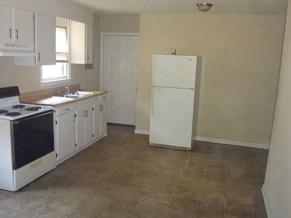 View of Kitchen/Dining from Side Entrance