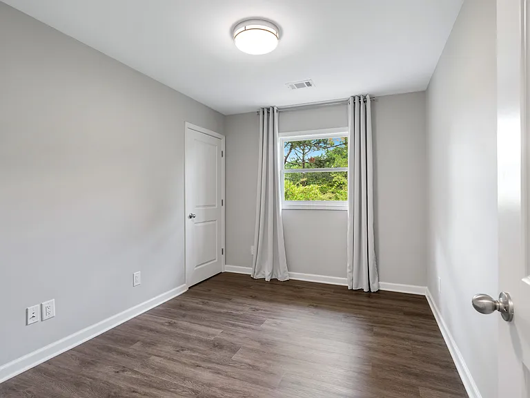 Cozy third bedroom, ideal for a home office or remote work setup.