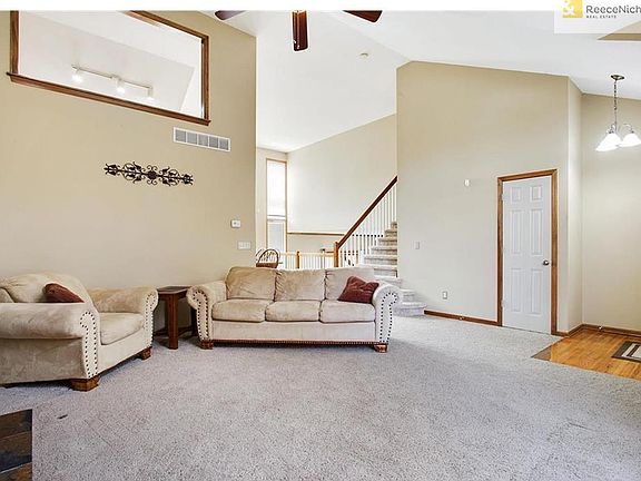 Additional view of the entryway and living room