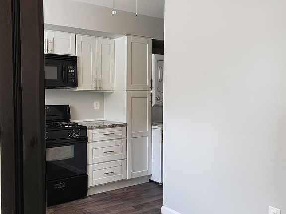 kitchen also has pantry cabinet and ceiling fan