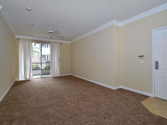 Spacious living area with private balcony.
