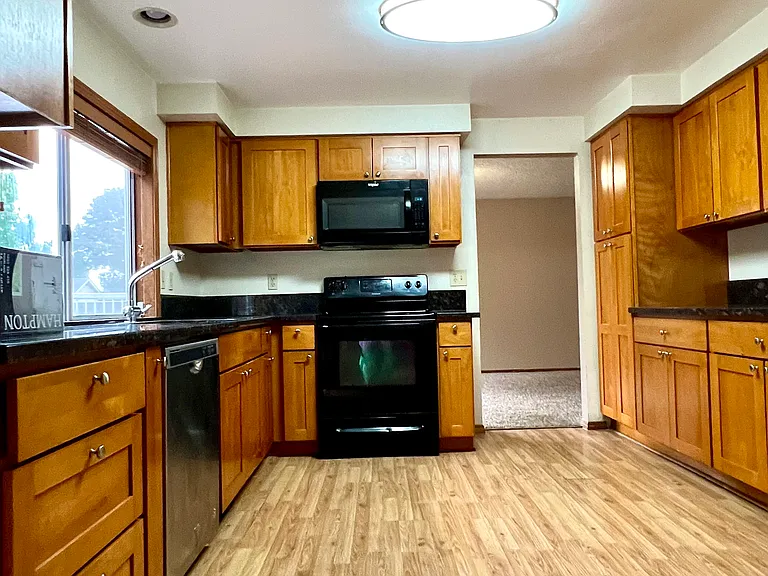 Cherry wood cabinets with granite counter top