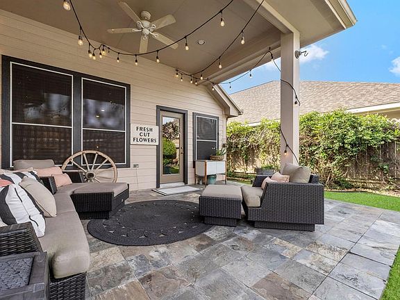 Covered back porch with extended slate patio.