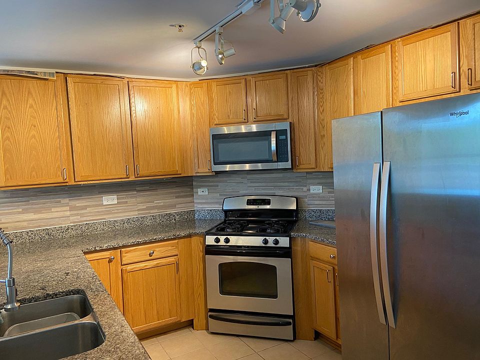 Granite countertop, stainless steel appliances (new microwave, new double-sided refrigerator, new restaurant grade faucet)
