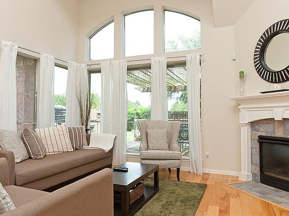 Open living area with natural light and high ceilings.