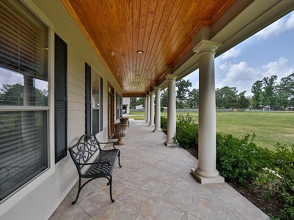  Beautiful columns lots of windows, and the leaded glass front door are sure to please.