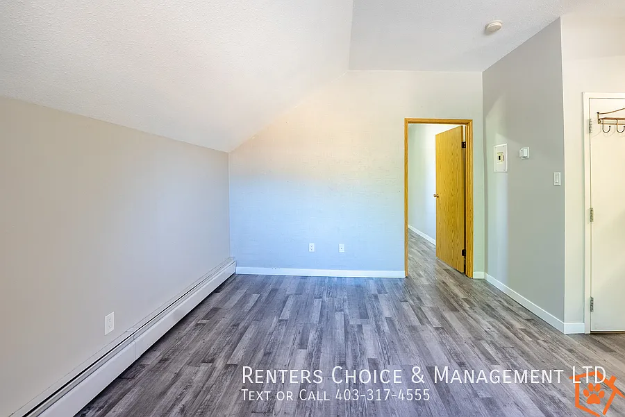 Main Floor Unit With Assigned Parking And Onsite Laundry — Photo 4