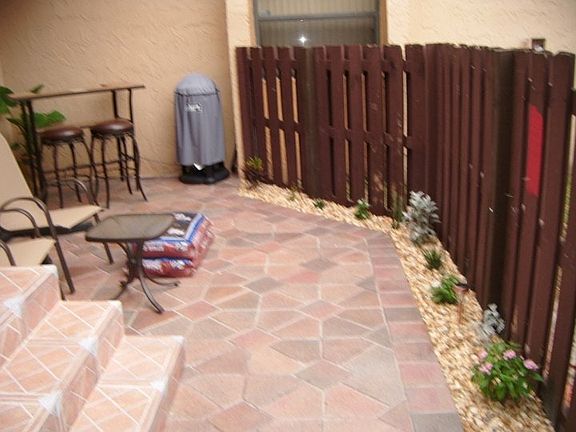 Renovated patio w new wood fence