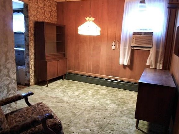 The window A/C unit shown in the formal Dining Room is included.