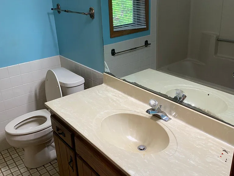 Upstairs bathroom - view of tub in mirror