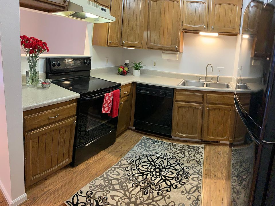 Kitchen opens to living and dining areas