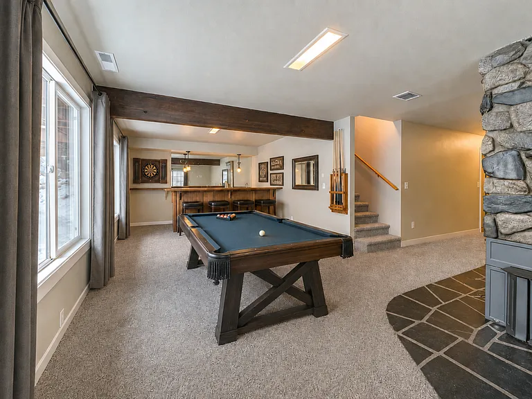 Downstairs bar and game room. Includes downstairs fireplace.