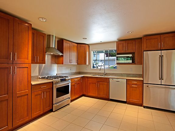 Gorgeous gourmet kitchen has cherry cabinets, granite and stainless.