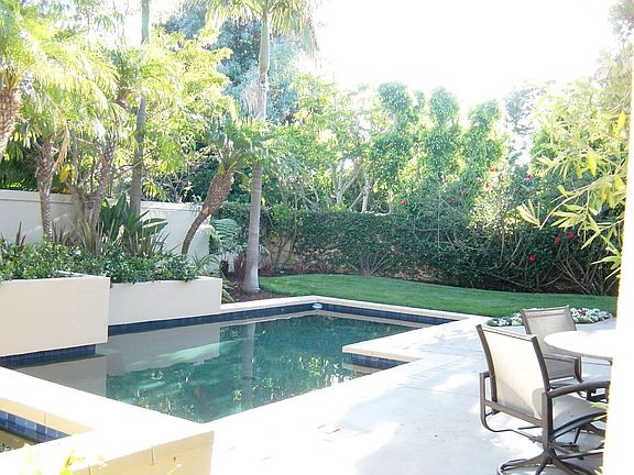 Another view of the spa & pool nestled in private rear yard.