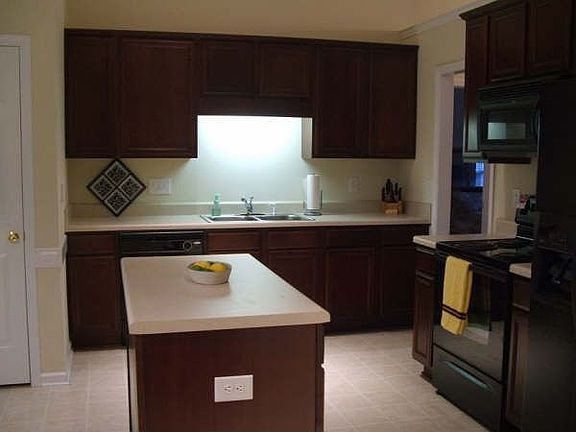 Beautiful cherry-stained cabs in kitchen with island-great for entertaining!