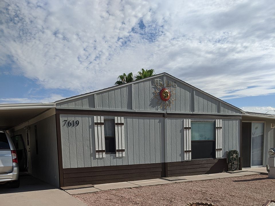 Left drive has carport. A second drive is on the right front. AZ Room also runs the full length of home and is not counted in the sq footage.