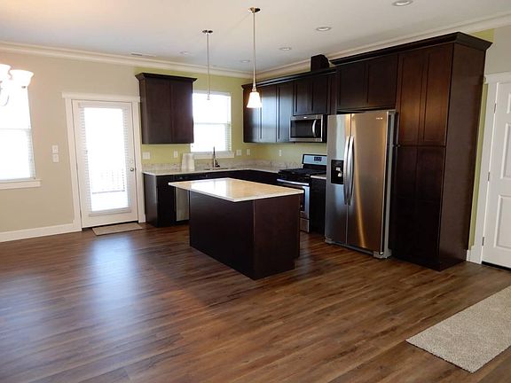 Island Kitchen with Granite Counters and Stainless Steel Appliances
