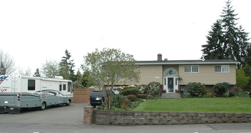 Front shows all the parking available with this home. Additional secure parking behind gate. sprinkler system makes this yard nice and green all year.