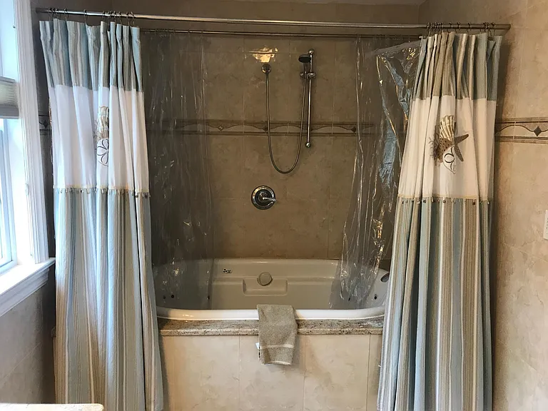 2nd floor bathroom with large shower area and 2-person air pool tub