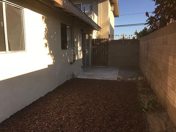 Note exit gate to street from back yard
