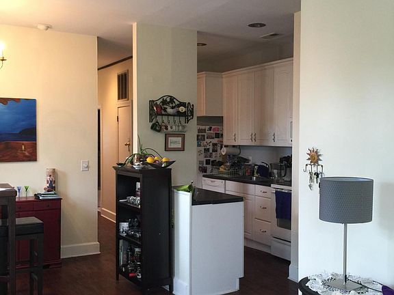 Remodeled kitchen with new electric stove/oven, microwave, sink with garbage disposal, and large refrigerator. Plenty of cupboard and drawer space.