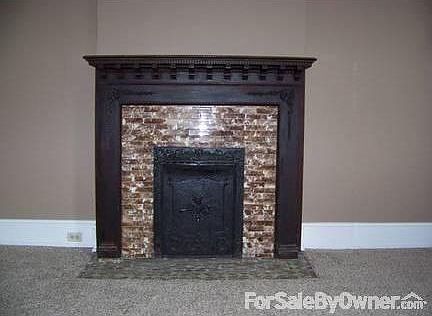 1898 craftsmanship
						:
						Decorative tile & woodwork. The cast iron summer cover is embossed