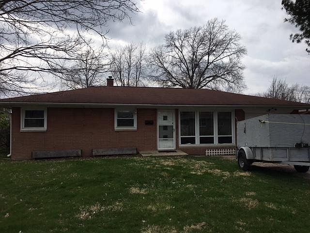 Front of the house on a not too sunny day, new windows and b