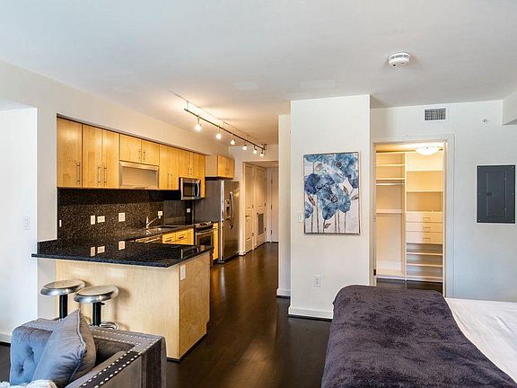 See breakfast bar and spacious custom-built walk-in closet.