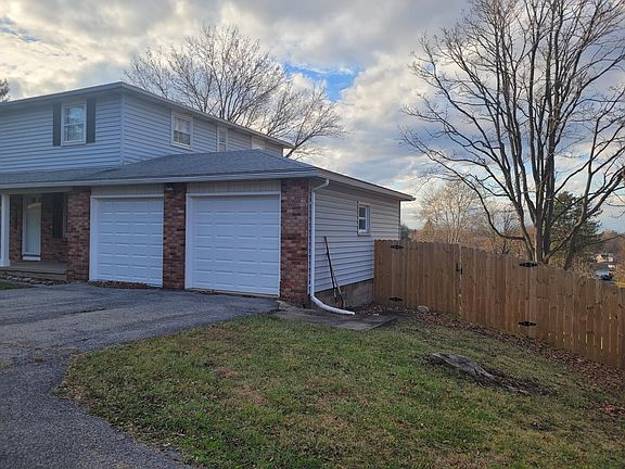 Attached garages for both units (1 car garage per unit)