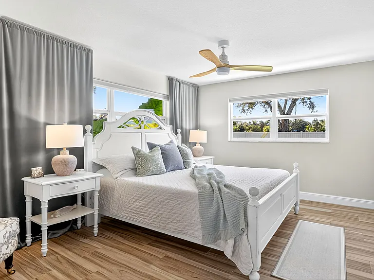 Primary bedroom with a king memory foam bed, attached bathroom and large walk-in closet.