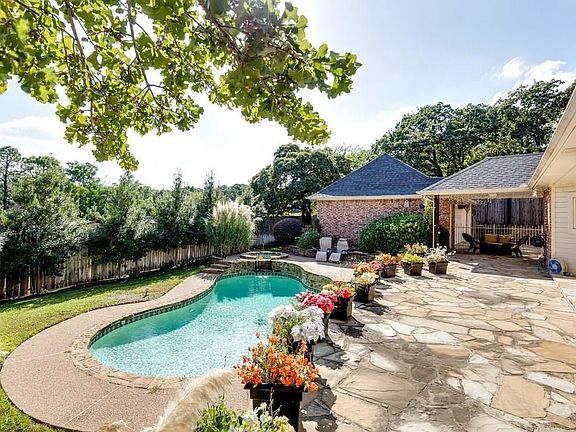 Enjoy a sparkling pool with raised spa and extensive patio area.