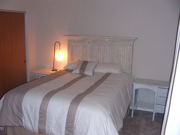 View of bedroom w/ new carpet