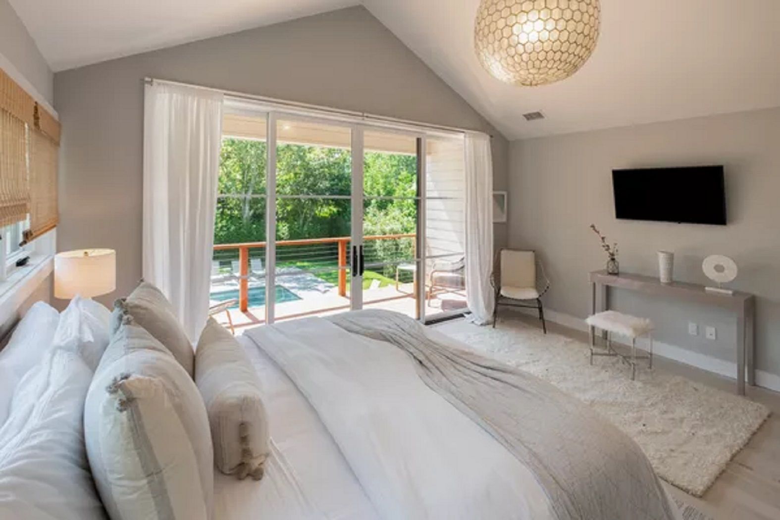 Primary one with king bed, full bath, deck, vaulted ceiling, huge walk in closet and SMART TV