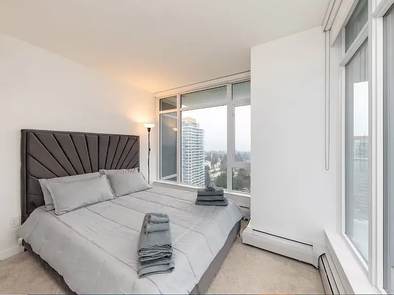 Discover a serene escape in our elegantly designed second bedroom. Compact yet stylish, this room offers a perfect blend of comfort and modern sophistication, complete with breathtaking views of the city.