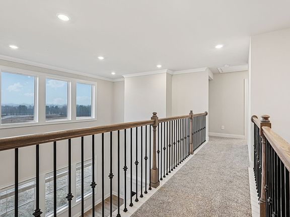 The view from the upstairs overlooks into the living room.